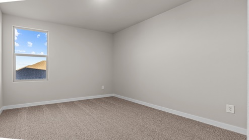 Upstairs guest bedroom with plush carpet floors