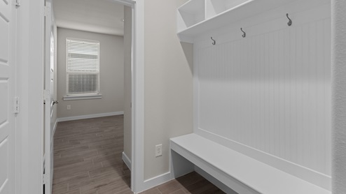 Foyer with mudroom space and additional storage