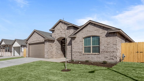 Side view of single story timeless brick home