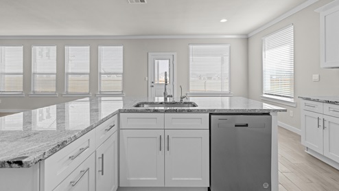 Spacious open concept kitchen with island and counter prep space