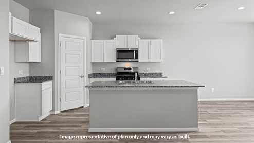 Spacious open concept kitchen with island and counter prep space