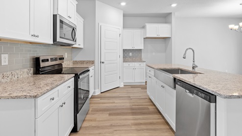 Stunning white kitchen with granite countertops on the MS Gulf Coast.