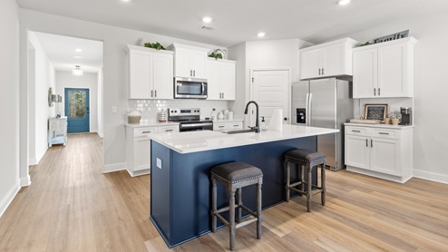 Kitchen island in the Dover floorplan by D.R. Horton.