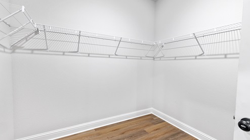 Spacious primary walk-in closet in a new construction home on the MS Gulf Coast.