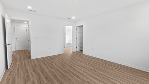 Spacious and neutral bedroom inside the Alston