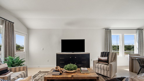 Living area with laminated wood flooring.