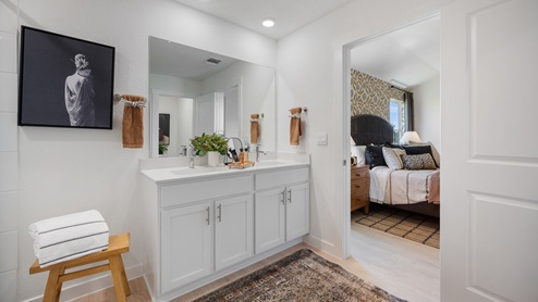 Bathroom 1 with laminated wood flooring.