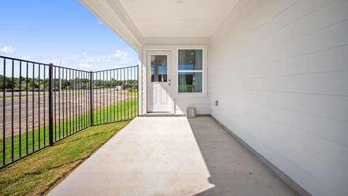 Back door with covered back patio.
