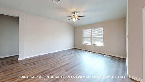 Monroe living room with vinyl plank flooring and windows for natural lighting.