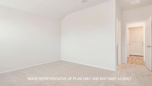 Schwertner Ranch model home secondary bedroom with carpet flooring and view of closet.