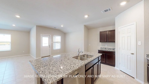 Texas Cali kitchen island with granite countertops and undermount sink.