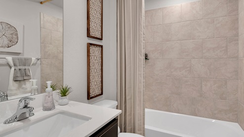 West Canyon Trails Model Home Secondary Bath with ceramic tile surround on the tub/shower combo