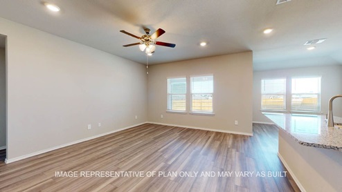 Fargo living room with plenty of windows for natural lighting.