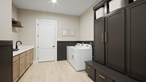 Powder room with white walls and light vinyl wood flooring.