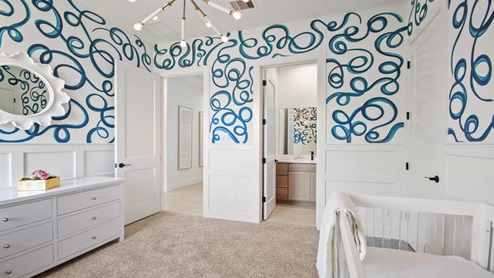Secondary bedroom with windows, white walls, and light carpet.