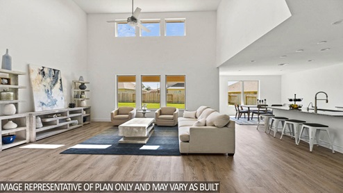 Family room with tall ceilings and big windows