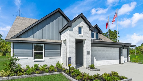 Holly Trails model home exterior elevation front view with two car garage.