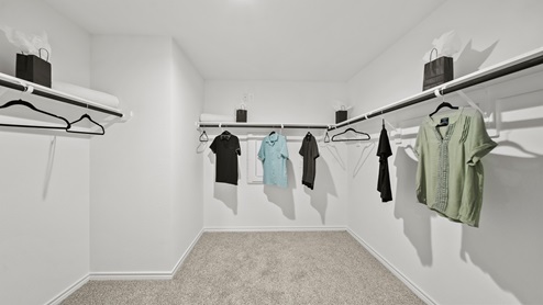 China Grove model home primary bedroom walk-in closet.