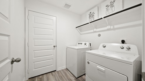 China Grove model home utility room with washer and dryer.