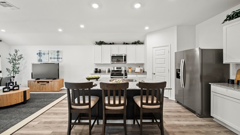 China Grove model home view of island equipped with three barstools for additional seating.