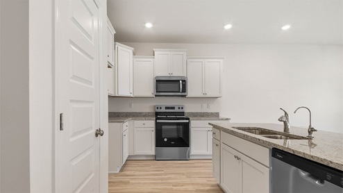 Kitchen with upper and lower cabinetry