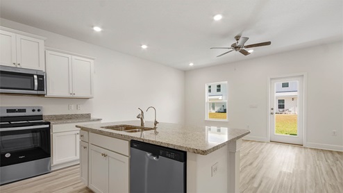 Open and spacious kitchen with stainless steel appliances
