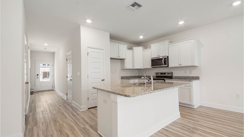 Kitchen with can lighting on ceiling