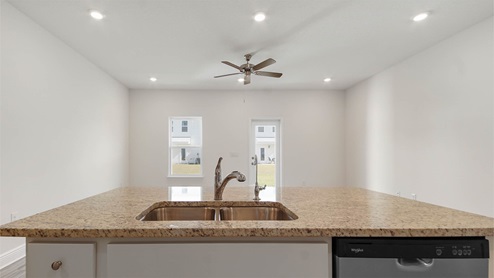 Kitchen with spacious center island with sink and dishwasher