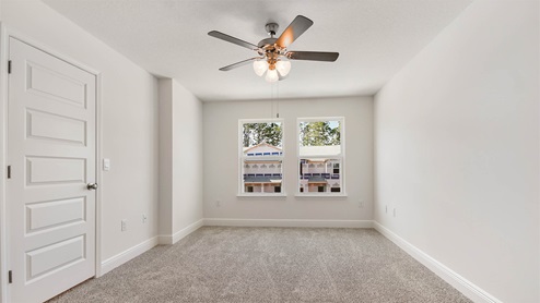 Primary bedroom has plenty of natural light