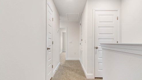 Second level hallway leading to additional bedrooms