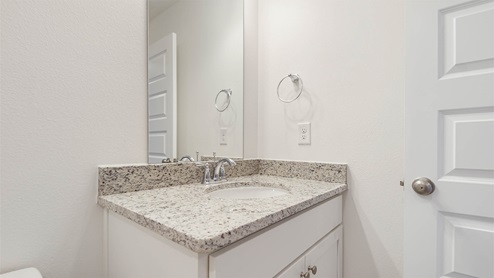 Second level shared bath with vanity featuring granite countertops