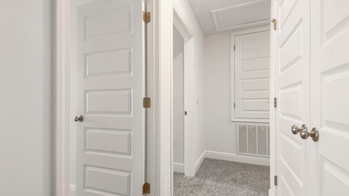 Second level hallway leading to additional bedrooms