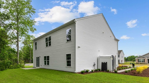 two story home with cream colored exterior