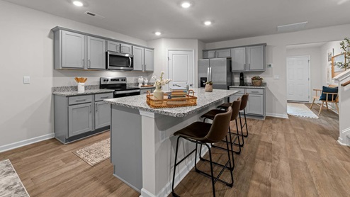 kitchen with island and granite countertops