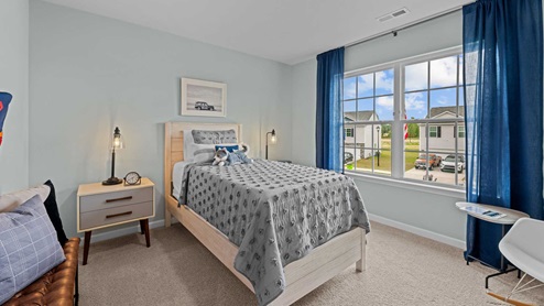 bedroom with carpet flooring and light blue walls