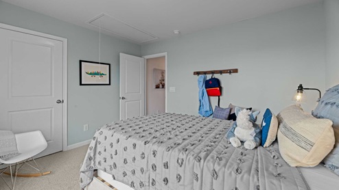 bedroom with carpet and light blue walls
