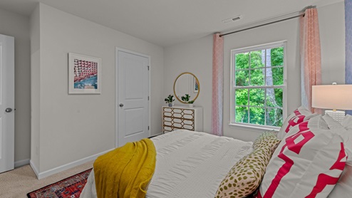 Bedroom with carpet flooring and window