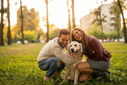 photo of happy couple with dog