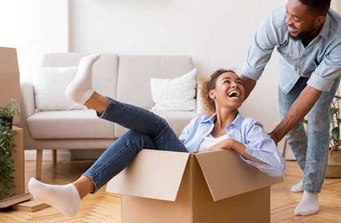 happy couple moving into new home