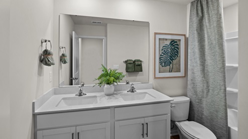 bathroom with quartz counters