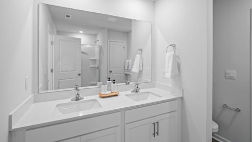 bathroom with quartz counters