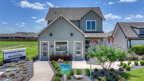 Two-story home with a 2 car garage.