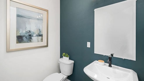 Half bathroom with a toilet and sink