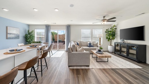 Interior photo of open concept living room leading to kitchen and dining room