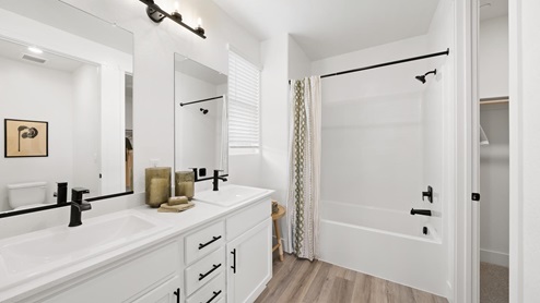Interior photo of primary bathroom connected to primary bedroom