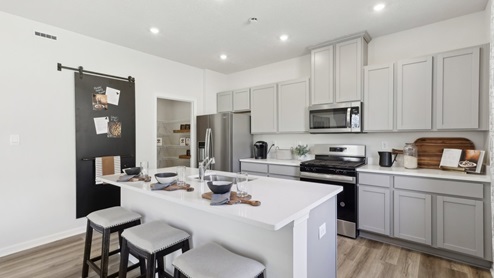 Kitchen with white cabinets and counter tops
