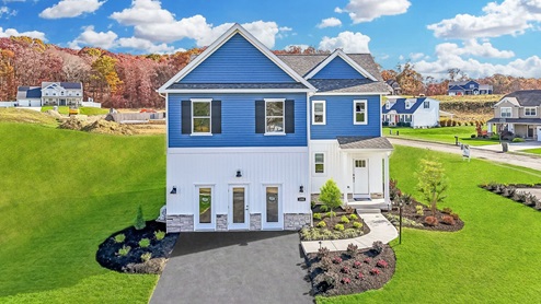 Exterior of Goldenrod meadows model with blue and white siding