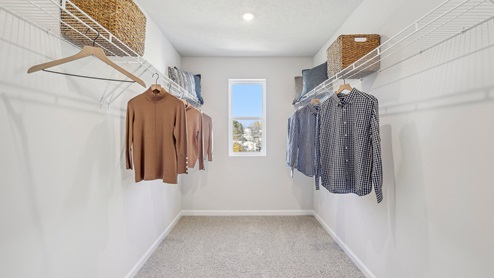 Deerfield Primary en suite bedroom walk-in closet with window