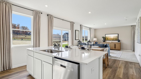Deerfield Large kitchen island overlooking dining and living room areas