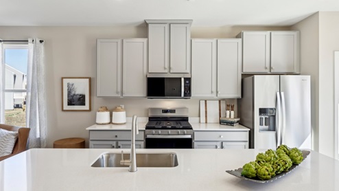 kitchen with large kitchen island and white quartz countertops